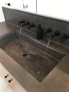 a sink that has some water running from it