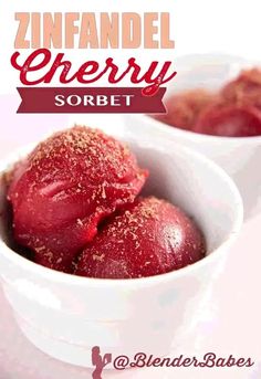 two white bowls filled with red desserts on top of a table