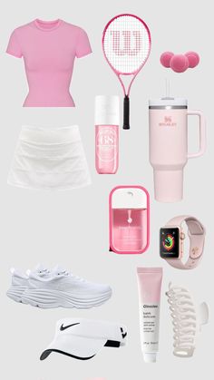 the contents of a woman's pink outfit including tennis racquet, cup and other items