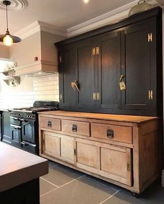 a kitchen with an oven and cabinets in it