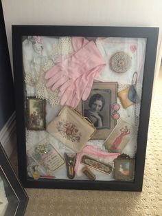 there is a shadow box with many items in it