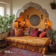 a large bed sitting in the middle of a room next to a potted plant