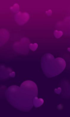 many pink hearts floating in the air on a purple background with space for your text