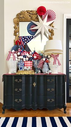 a black dresser with red, white and blue decorations on it