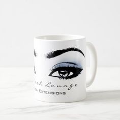 a white coffee mug with an image of a woman's eye