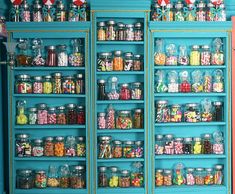 the shelves are filled with many different kinds of candy