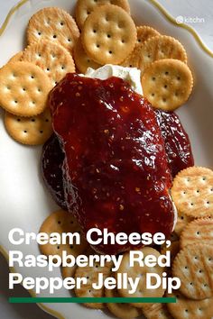 cream cheese, raspberry red pepper jelly dip with crackers on the side