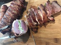 some meat is being cut up on a cutting board