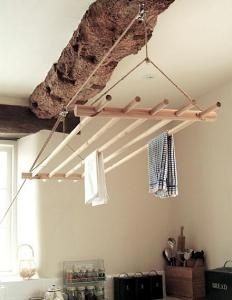 clothes hanging from a rope in a bedroom