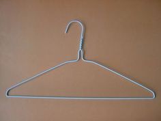 a white hanger on a brown surface