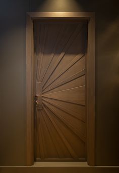 an open wooden door in a room with light coming through the top and bottom half