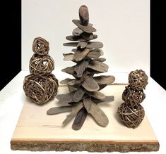 a group of wooden ornaments sitting on top of a white table next to each other