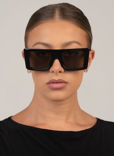 BLACK FLAT TOP OVERSIZED SUNGLASSES IN BLACK WITH BLACK SMOKE LENS PRODUCT DETAILS Frame Shape: Squared Oversized Frame Color: Shiny Black Lens Color: Smoke, Lens Category 3 100% UV Protection Comes with a Protective Vegan Pouch SIZE MM INCHES FRAME WIDTH 142MM 5.5" FRAME HEIGHT 50.2MM 1.97" NOSE GAP 23MM 0.9" Oversized Sunglasses, Flats Top, Black Flats, Uv Protection, Gap, Pouch, Sunglasses, Frame, Black