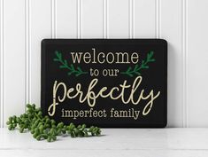 a sign that says welcome to our perfectly imperfect family