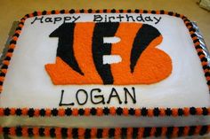 a birthday cake with the number thirteen on it, decorated to look like a tiger