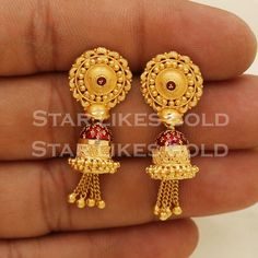 Elevate your style with these beautifully handcrafted gold earrings. Featuring a classic design and a comfortable fit, they add a refined touch to any look. Ideal for everyday wear or special occasions, they bring a subtle yet sophisticated sparkle. 22K Gold Earrings Metal is Real Gold Purity is 22kt Weight is 7.69 grams approx. Max Length is 3.6 centimeter approx. Max width is 1.3 centimeter approx. The earrings come with normal backs if you real gold screw please contact Please feel free to as Luxury Fusion Yellow Gold Jhumkas, Luxury Yellow Gold Jhumkas As Gift, Old Buttalu Earrings Gold, Luxury Gold Chandbalis For Ceremonial Occasion, Luxury Gold-plated Chandbalis For Celebration, Cheap Gold Temple Jewelry Danglers, Luxury Gold Chandbalis For Festivals, Long Buttalu Earrings Gold, Bugdi Earrings Gold