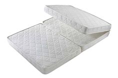 two white mattresses sitting on top of each other