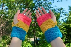 Pansexual knit hand warmers. These fingerless gloves are hand-knit with attention to detail, ensuring a comfortable and stretchy fit for a wide range of hand sizes. Designed for both fashion and functionality, these gloves keep your hands warm while leaving your fingers free. They are ideal for chilly days, outdoor activities, or simply making a fashion statement. Made with soft and durable yarn, these gloves provide a cozy and comfortable feel against your skin. Their versatile design makes them suitable for various styles, from casual outfits to alternative fashion. The gloves are made with the colors of the pansexual flag. ♥ Glove Size: - Dimensions when not worn: 18cm (7 in.) long, 9.5cm (3.75 in.) wide - One order comes with two gloves (pair) - To ensure the gloves fit you, measure th Knit Hand Warmers, Knit Fingerless Gloves, Pansexual Flag, Knit Gloves, Fingerless Gloves Knitted, V Stitch, Pride Outfit, Knitted Gloves, Pride Flag