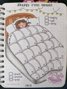 an open notebook with a drawing of a girl sleeping in her bed and the words january mood tracker on it