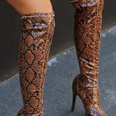 An Over-The-Knee Boot With A Platform Sole And Stiletto Heel. Material: Faux-Leather Features: Sd Dream Sole - Double The Padding For Comfort, Support, And Ease Of Movement Platform Height: 1.3" Outside Heel Height: 5.12" Closure: Functional Inside Zipper Shaft Height: 19.88" Color: Natural Snake Size: 8.5 ( Pre-Owned) Ask About Discount $ *** All Shoes Are Mailed Without Original Box****** If You Need A Box, Please Ask Prior To Making Payment. Shipping Charges Will Be Adjusted. Please Ask Quest Trendy Brown Knee-high Heels, Fall Snake Print High Heels, Brown Synthetic Party Boots, Trendy High Heel Snake Print Heels, Brown Glamorous Pointed Toe Heels, Chic Snake Print Heels, Snake Print Party Boots, Glamorous Brown Pointed Toe Heels, Flat Riding Boots