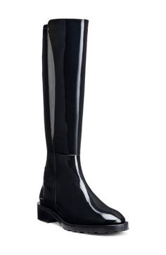 A stretchy back panel and knee-high silhouette amplify the modern appeal of a soft boot grounded by a grippy lugged sole. 1 1/2" heel Leather and textile upper/synthetic lining/leather and textile sole Made in Spain Luxury Lug Sole Knee-high Boots For Fall, Winter Black Knee-high Boots With Lug Sole, Black Knee-high Boots For Outdoor, Leather Knee-high Boots With Lug Sole, Medium Width Knee-high Boots With Lug Sole, Stuart Weitzman 5050, Soft Boots, Lug Boots, Lug Sole