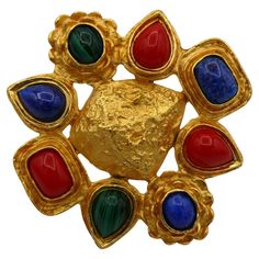 CHRISTIAN LACROIX vintage massive gold tone brooch featuring a textured center adorned with faux gemstones glass cabochons. Marked CHRISTIAN LACROIX CL Paris. Indicative measurements : height approx. 7.3 cm (2.87 inches) / width approx. 7.8 cm (3.07 inches). Comes with the original CHRISTIAN LACROIX box (used vintage condition). Material : Gold tone metal hardware / Glass. NOTES - This is a preloved vintage item, therefore it might have imperfections. - Colors may differ slightly from actual pro Asymmetrical Black Dress, Gemstone Brooch, Christian Lacroix, Vintage Jewels, Metal Hardware, Gold Tone Metal, Vintage Charms, Brooches, Vintage Items