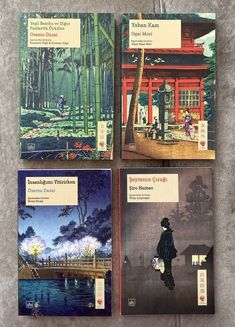 four books are shown on the floor in front of a building and trees, one has an image of a man with a fishing rod