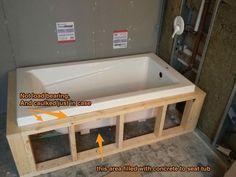 an unfinished bathtub in the middle of construction