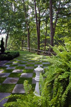 a chess board in the middle of a garden