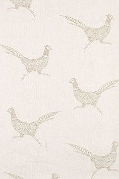 a white fabric with birds on it