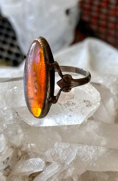 Circa 1920s Art Deco Dragons Breath Art Glass Sterling Silver Antique Ring Ring size 4, can be sized by a skilled jeweler Vintage Amber Jewelry With Polished Finish, Antique Oval Collectible Rings, Vintage Oval Moonstone Ring With Polished Finish, Vintage Hallmarked Oval Opal Ring, Vintage Oval Hallmarked Opal Ring, Vintage Oval Moonstone Ring Hallmarked, Vintage Cabochon Round Rings, Art Deco Oval Cabochon Gemstone Jewelry, Vintage Round Cabochon Rings