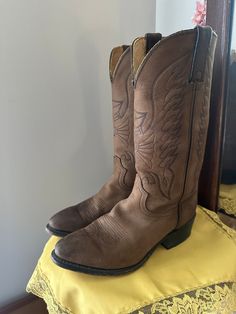 Vintage Western Angel Wings Boots, Durango Thunderbird Boots, Vintage Brown Cowgirl Boots, Ladies Western Hearts And Wings Boots, Size 7.5 Stunning and so artistically detailed vintage Durango Western boots. Cool angel wings and hearts adorn these amazing boots.  From a distance, it looks like a falcon bird or thunderbird with wings on the front and back!  Whatever you see when you look at the pattern, for a certainty these boots are very cool and unique! Overall, excellent vintage condition with no glaring flaws. Show desirable signs of vintage wear and charm. Please study photos as they are part of the description. Size 7.5 All sales are final Falcon Bird, Brown Cowgirl Boots, Wing Boots, Boots Vintage, Study Photos, Vintage Western, Vintage Wear, Cowgirl Boots, Vintage Brown