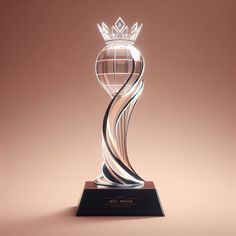 a crystal trophy with a crown on top