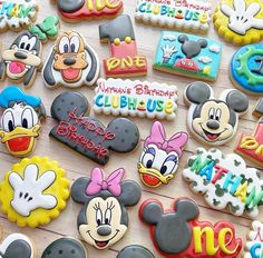 mickey mouse and donald duck cookies are on display for the guests to enjoy their birthday