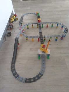 a toy train set is shown on the floor