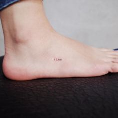 a person with a small tattoo on their foot that says i love you in cursive writing