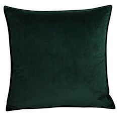 a dark green pillow on a white background