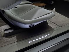 a car seat with the word welcome written on it