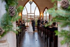 the bride and groom are walking down the aisle