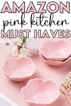 three pink bowls with the words amazon pink kitchen must haves on them and flowers