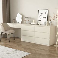 a white desk with two chairs and a large mirror on the wall next to it