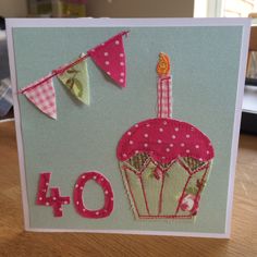 a birthday card with a cupcake and bunting flags