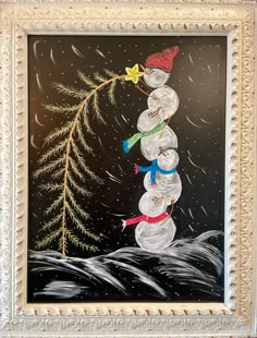 a painting of a snowman is hanging on the wall