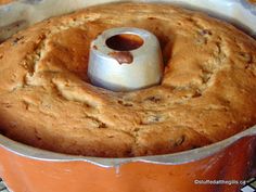 a bundt cake in a baking pan with a metal ring on the top and bottom