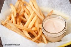 french fries with dipping sauce in a basket