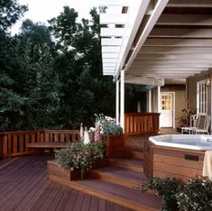 a hot tub sitting on top of a wooden deck