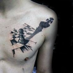 a man with a chess piece tattoo on his chest