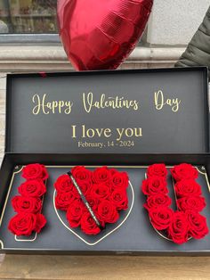 valentine's day box with two heart shaped roses in it