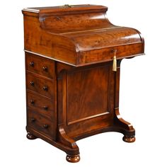 an old fashioned wooden desk with drawers