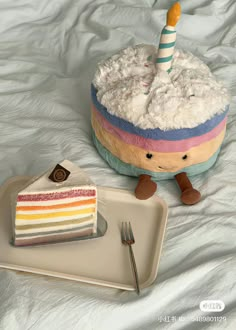 a piece of cake sitting on top of a plate next to a slice of cake